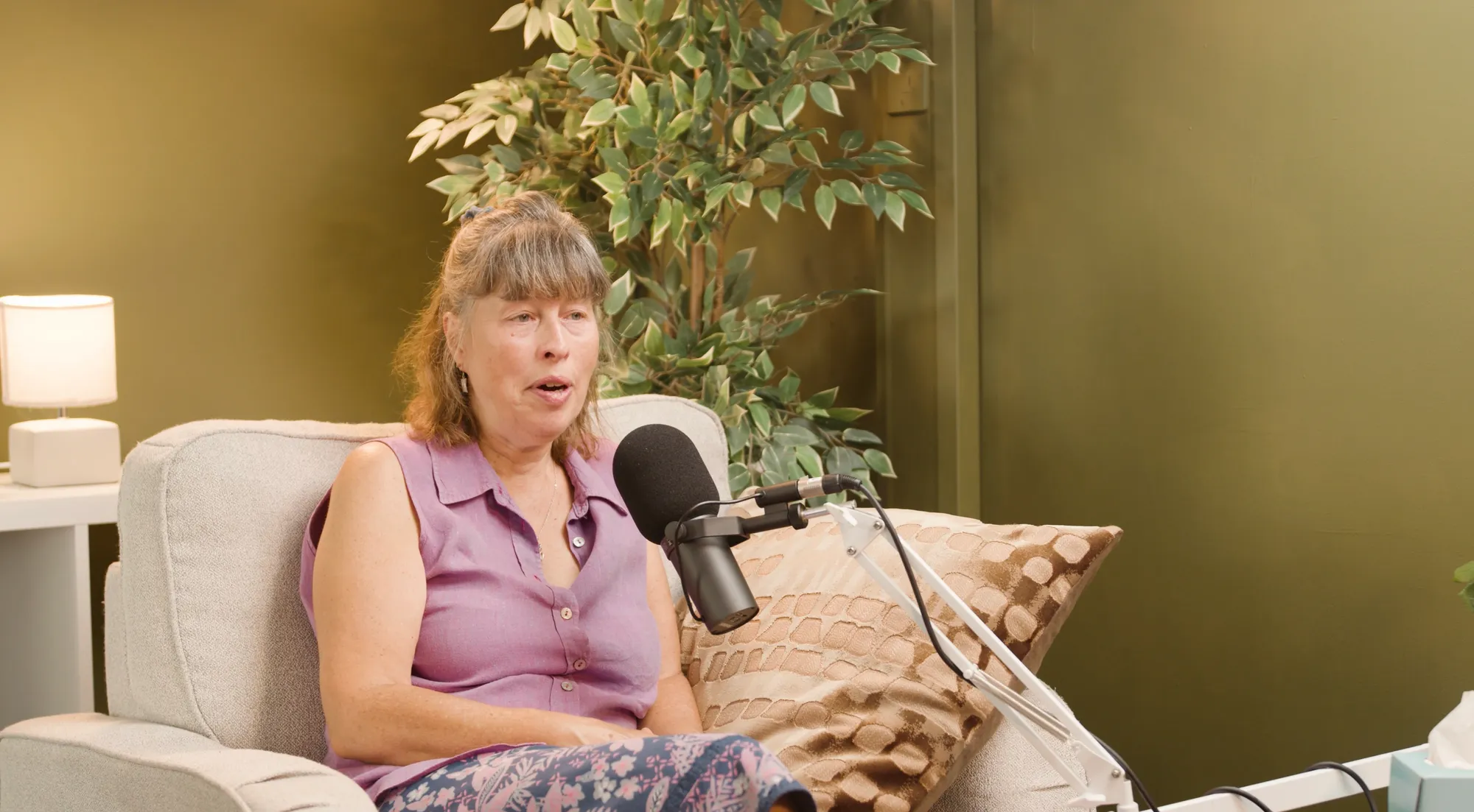 A presenter recording in The Olive Tree